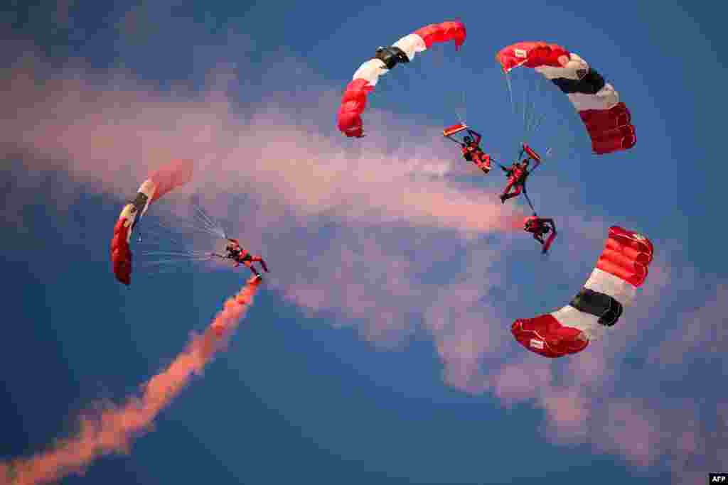 Parachutists perform as they descend to Utah Beach as part of the "D-Day" commemorations marking the 80th anniversary of the World War II Allied landings in Normandy, France. 