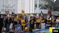 在台流亡港人與香港青年團體等2024年3月23日於台北發起街頭集會，同聲譴責當日生效的香港《基本法》第23條，並呼籲國際社會制裁港府、立法會議員及香港法官(美國之音特約記者黃麗玲拍攝)。
