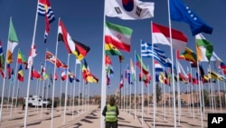 A member of the security forces stands guard outside a convention center hosting the IMF and World Bank annual meetings, in Marrakech, Morocco, Oct. 9, 2023. 
