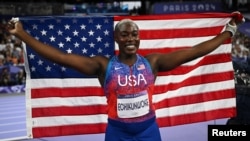 Annette Echikunwoke of the U.S. celebrates after winning a silver medal at the Paris Olympics on Aug. 6, 2024. Echikunwoke competed for the U.S. after her home country of Nigeria's non-compliance with drug testing kept her out of the Tokyo Games in 2021.