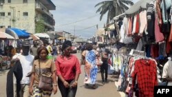 People browse at a market on the side of a road in Libreville on Sept. 2, 2023. Gabon's army said on Sept. 2, 2023, that it would reopen the country's borders, closed in the wake of the military coup that ousted ex-president Ali Bongo Ondimba.