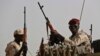 Sudanese soldiers from the Rapid Support Forces unit, led by Gen. Mohammed Hamdan Dagalo, the deputy head of the military council, secure the area where Dagalo attends a military-backed tribe's rally, in the East Nile province, Sudan. (Hussein Malla/AP Photo)

