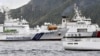 A China Coast Guard vessel sails near a Japan Coast Guard vessel Kabira off Uotsuri Island, one of a group of disputed islands called Senkaku Islands, also known in China as Diaoyu Islands, in the East China Sea, Apr. 27, 2024. (Kyodo/via Reuters) 