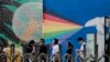 FILE - Visitors to the U.S. consular service line up outside the U.S. embassy in Beijing, Aug. 1, 2022. The Chinese government has protested to the United States over the treatment of Chinese arriving to study in America.