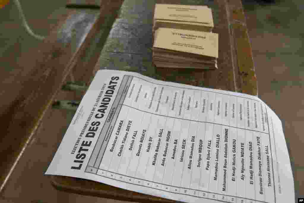 A list of presidential candidates is placed inside a voting station, during the presidential elections in Dakar, Senegal, March 24, 2024.