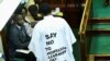 Member of Ugandan Parliament John Musira, dressed in an anti-gay gown, attends the debate of the Anti-Homosexuality Act in Kampala, Uganda, March 21, 2023.