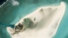 Foto satelit yang diabadikan oleh Planet Labs PBC menunjukkan Pulau Triton di Laut China Selatan, 20 Februari 2023. (Foto: Planet Labs PBC via AP)
