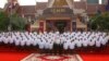 FILE - Cambodia's King Norodom Sihamoni, front center, poses with the nation's lawmakers during a photo session in front of the National Assembly in Phnom Penh, Cambodia, Wednesday, Sept. 5, 2018.