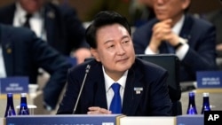 FILE - South Korea's President Yoon Suk Yeol attends a session of the NATO summit with Indo-Pacific Partners, July 11, 2024, in Washington. 