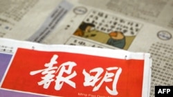 A photo illustration shows the front page of the Ming Pao News and a cartoon by cartoonist Wong Kei-kwan, who uses the nom de plume "Zunzi", on May 10, 2023. The political cartoonist will have his newspaper columns suspended from May 14.