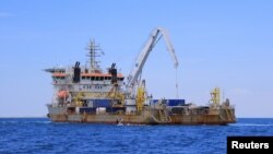 A vessel in charge of unloading oil from the decaying vessel FSO Safer is pictured off the coast of Ras Issa, Yemen, prior to the start of the unloading operation led by the United Nations to avoid an oil spill in the Red Sea, May 30, 2023.