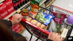 Jaqueline Benitez shops for groceries at a supermarket in Bellflower, Calif., Feb. 13, 2023. Tens of millions of Americans who got extra government help with grocery bills during the pandemic will soon see that aid shrink.