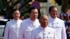 President of the National Assembly Heng Samrin, front, walks together with, Deputy Prime Minister and Minister of Interior Ministry Sar Kheng, right, Prime Minister Hun Sen, center, and Hun Manet, left, at the National Assembly in Phnom Penh, Cambodia, Monday, Aug. 21, 2023.