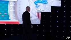 FILE - President Joe Biden walks off the stage during a break at his debate with Republican presidential candidate former President Donald Trump, in Atlanta, Georgia June 27, 2024. Biden dropped his bid for a second term in the White House on July 21, 2024.