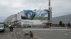 A woman pats a dog at a nuclear power plant in Chernobyl, Ukraine, April 26, 2023. 