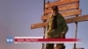 Naizghi Gebremedhin stands at the summit of Kenya's Mount Kenya in this undated photo. 