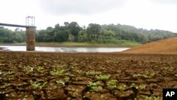 The almost dry water reservoir of Combani is visible, on the French Indian Ocean territory of Mayotte, Oct. 10, 2023. The government is pinning its hopes on the upcoming rainy season, though residents say it won't be enough to fix the deep-seated water problems.