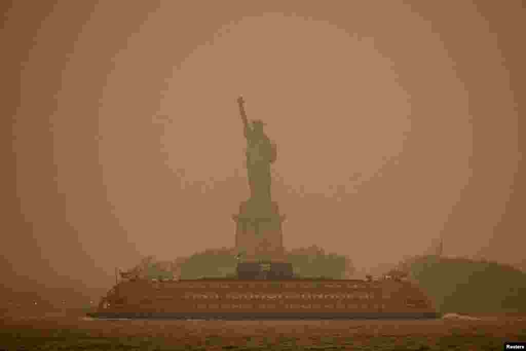 The Statue of Liberty is covered in haze and smoke caused by wildfires in Canada, in New York, June 6, 2023.