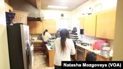 Asylum-seekers from Africa cook at the small church kitchen in Riverton Park United Methodist Church in Tukwila, Washington.