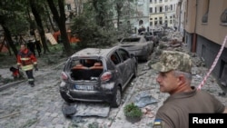 A view shows a site of a residential building hit by a Russian missile strike, amid Russia's attack on Ukraine, in Lviv, Ukraine, July 6, 2023.