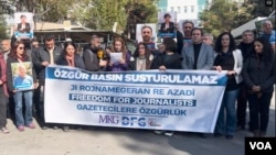 FILE - Kurdish journalists protest in Diyarbakir, Turkey, Dec. 4, 2023.