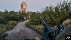 FILE - A Ukrainian soldier sits in his position in Avdiivka, Donetsk region, Ukraine, Aug. 18, 2023. 
