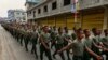FILE - This photo taken on April 17, 2019, shows United Wa State Army (UWSA) soldiers walking during a ceremony in Panghsang to commemorate 30 years of a ceasefire signed with the Myanmar military in the Wa State.