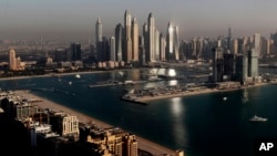 FILE: Luxury towers dominate the skyline in the Dubai Marina district, center, and the new Dubai Harbor development, right, as seen from the observation deck of "The View at The Palm Jumeirah" in Dubai, United Arab Emirates, on April 6, 2021. 