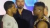 Anthony Joshua et Francis Ngannou se regardent après une conférence de presse précédant leur combat de boxe, Riyad, le 6 mars 2024.