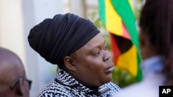 FILE - Linda Masarira, a presidential candidate speaks to the press outside the High Court in Harare, Zimbabwe, June 23 2023. 