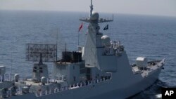 FILE - A Chinese warship takes part in naval drills in the Arabian Sea, off the coast of Karachi, Pakistan, Feb. 13, 2023. 