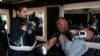 John Simon, remaja yang menjalani operasi bariatrik pada tahun 2022, berolahraga bersama pelatihnya Chris Robles di El Workout Fitness, Los Angeles, Senin, 13 Maret 2023. (AP/Jae C. Hong)