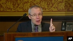 In this image taken from a video, Sean Turnell, an economist at Australia’s Macquarie University, speaks in front of audience at the Lowy Institute in Sydney, Australia on Nov. 28, 2013.