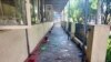 A parcel-reception location at the entrance of the Insein prison sits damaged after an explosion Wednesday, Oct. 19, 2022, in Yangon, Myanmar. (Military True News Information Team via AP)