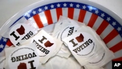 I voted stickers are seen at a polling place, Sunday, March 15, 2020, in Steubenville, Ohio.