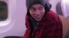 In this image made from video provided by Russian Federal Security Service, WNBA star and two-time Olympic gold medalist Brittney Griner sits in the plane as she flies to Abu Dhabi to be exchanged for Russian citizen Viktor Bout, in Russia, Dec. 9, 2022. 