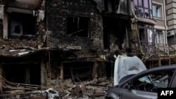 A destroyed building is pictured in Bucha, northwest of Kyiv, on April 2, 2022, where town's mayor said 280 people had been buried in a mass grave and that the town is littered with corpses.