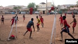 FILE - A neighborhood team plays soccer in the ACI 2000 neighborhood of Bamako, Mali, May 10, 2018.
