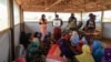 FILE - Women and young girls attend a class in Maroua, Cameroon, on April 28, 2022. Some 30,000 Cameroonian women took to the streets in Yaounde on International Women's Day, March 8, 2024, to call for educational, economic and social equality.