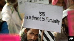 "ISIS (groupe Etat islamique) est une menace à l'humanité" à New Delhi, Indie, le 18 novembre 2015.