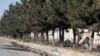 FILE - This picture taken on Jan. 1, 2023 shows the site of an explosion next to the entrance to a military airfield in Kabul. 