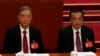 FILE - Chinese Premier Li Keqiang, right, and Wang Yang, a former vice premier, attend the closing ceremony of the 20th National Congress of China's ruling Communist Party at the Great Hall of the People in Beijing, Oct. 22, 2022.