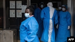 FILE - Medical staff in protective gear at Mubende Regional Referral Hospital, in Mubende, Uganda, Sept. 24, 2022.