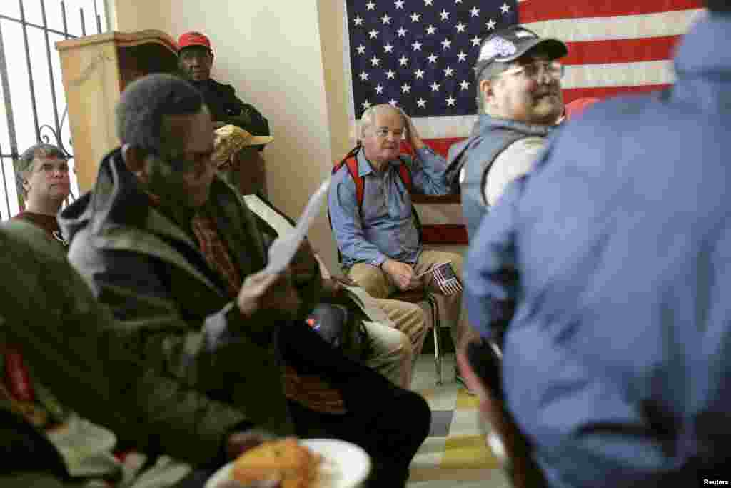 A group of veterans await a clothing giveaway at St. Anthony Foundation in San Francisco, California, Nov. 8, 2013. 