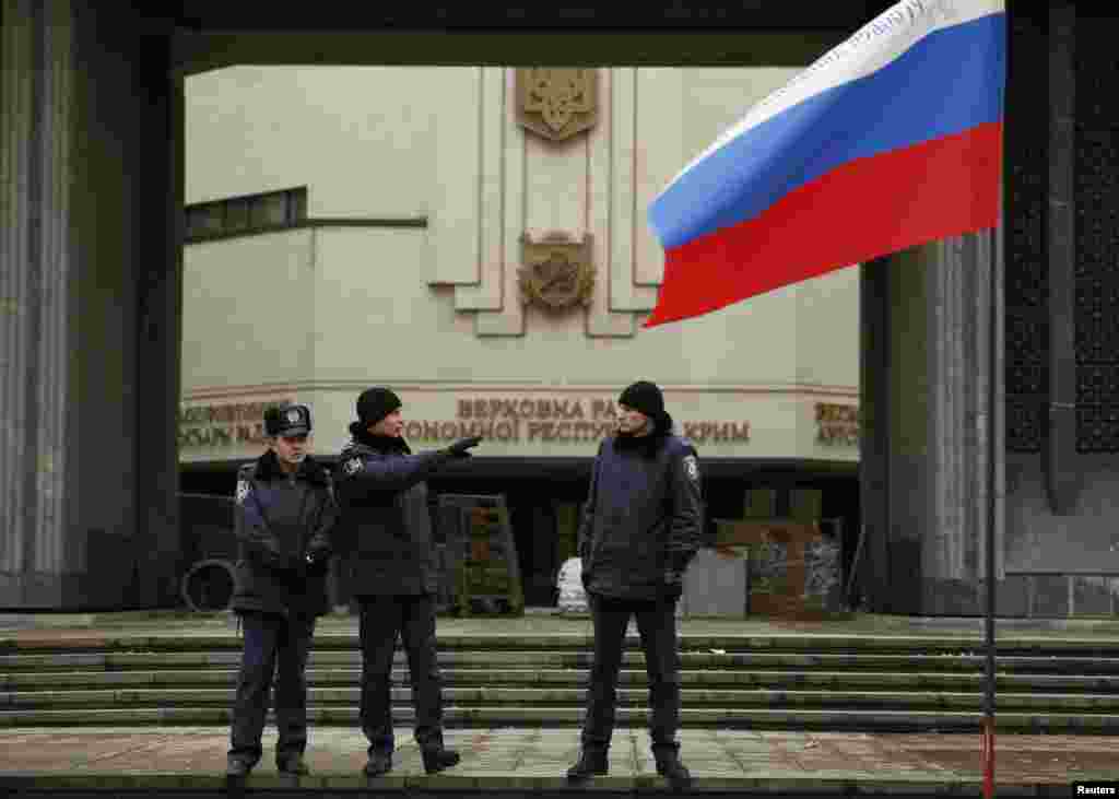 Police stand guard at a local parliament in Simferopol, Crimea, Ukraine, Feb. 28, 2014.