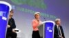 European Commission President Ursula von der Leyen, center, speaks during a media conference at EU headquarters in Brussels, July 14, 2021. The European Union unveiled new legislation to help meet its pledge to cut climate-changing emissions.