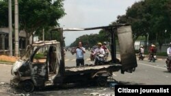 Scene after angry mobs burn, loot scores of foreign-owned factories, Binh Duong province, Vietnam, May 14, 2014.
