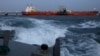 ARCHIVO - Un buque cisterna es cargado de petróleo en una terminal de PDVSA en abril de 2015.