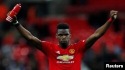 Paul Pogba dari Manchester United melakukan selebrasi di penghujung pertandingan, 13 Januari 2019. (Foto: REUTERS/Eddie Keogh)