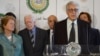 Syria peace envoy Lakhdar Brahimi, behind podium at Arab League headquaraters in Cairo Oct. 24, 2012. Seen in the background from left are former president of Ireland Mary Robinson (R) and former US president Jimmy Carter (2nd L)